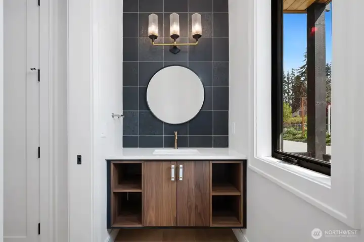 Designer touches everywhere. Floating Belmont walnut cabinet with towel pockets in powder bath on. Main.
