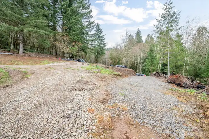 Left to flat building site. Right goes to outbuildings