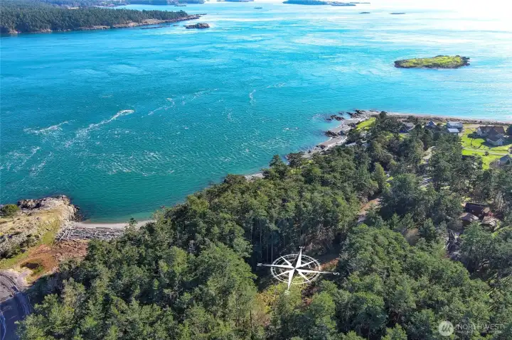 Aerial perspective showcasing the stunning Cape San Juan coastline, nearby beaches, and the peaceful island setting surrounding this San Juan Island parcel.