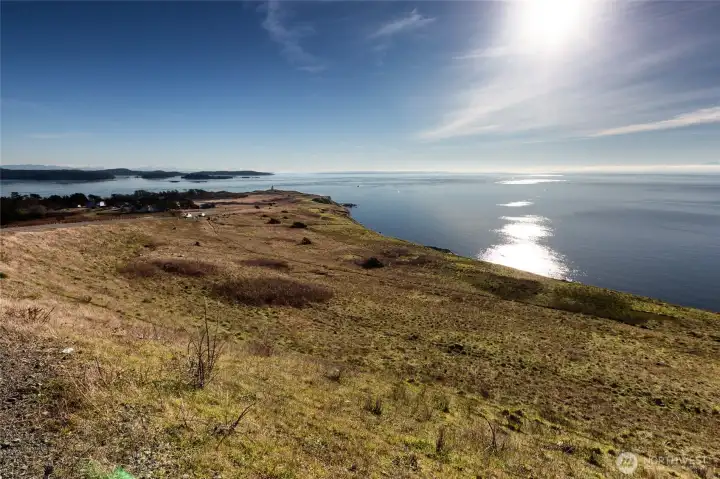 Expansive shoreline landscape with sweeping Salish Sea views, highlighting the natural beauty near this San Juan Island property.