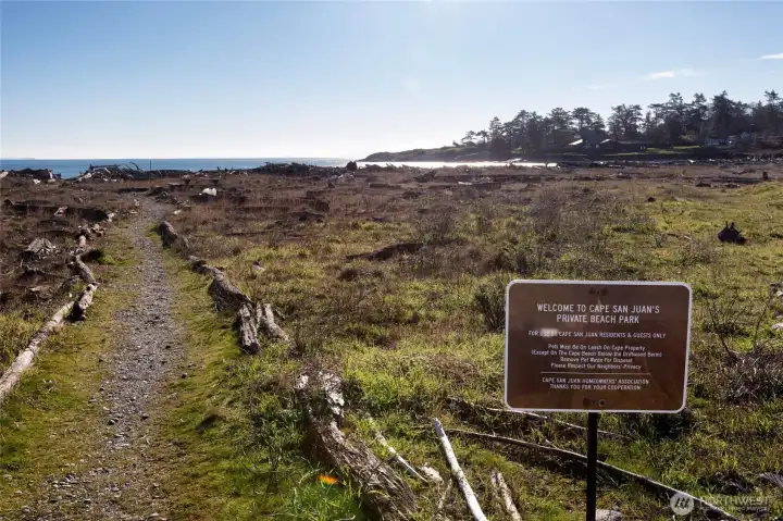 Pathway entrance to Cape San Juan’s private beach park, offering residents access to shoreline walks, open space, and coastal recreation.