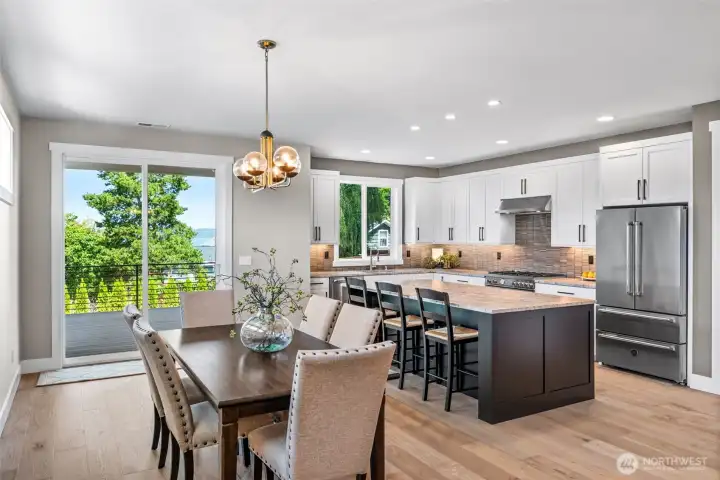 Partial water view from the dining room & from the kitchen...making clean up a little more enjoyable!  Expansive dining area would easily allow for a table for 10 or 12