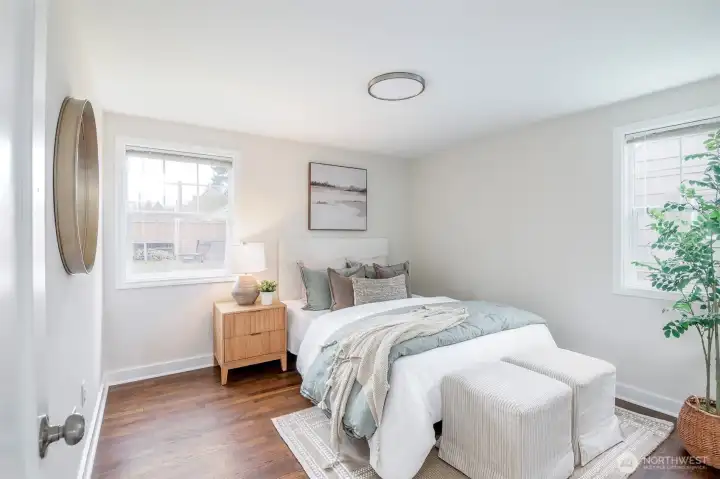 Bright and versatile main level bedroom for guests or home office.