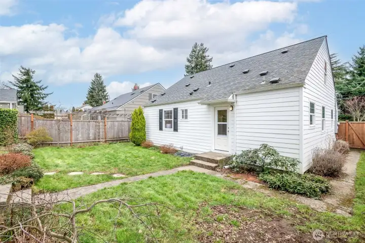 Generous yard space ready for gardening, entertaining, or play.