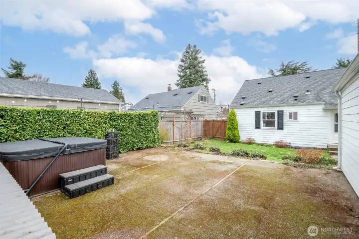 Entertaining ready outdoor space with room to host and relax. Hot tub stays with home.