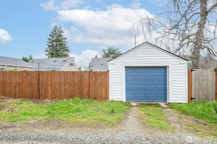 Detached garage with convenient alley access.