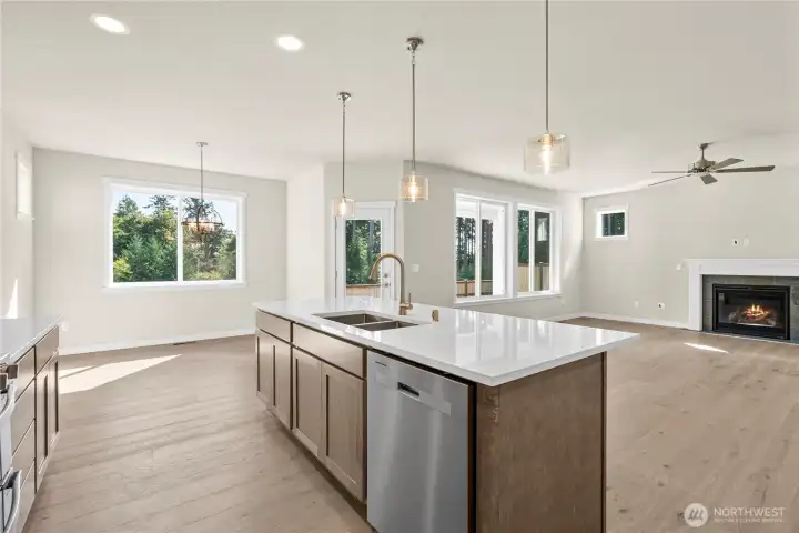 Pendant lighting above island perfect for casual meals and entertaining.