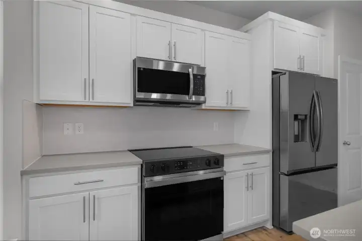 All the appliances are included - Over Oven Microwave, Glass Top R/O, 2 door Refrigerator with freezer drawer - and the Washer and Dryer upstairs in the laundry.