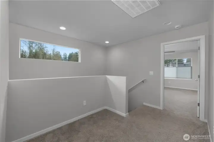Versatile upper landing—ideal for a home office, reading nook, or additional living space.