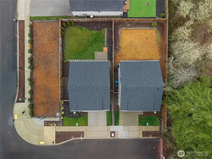 Aerial view showcasing private lot and fenced yard.