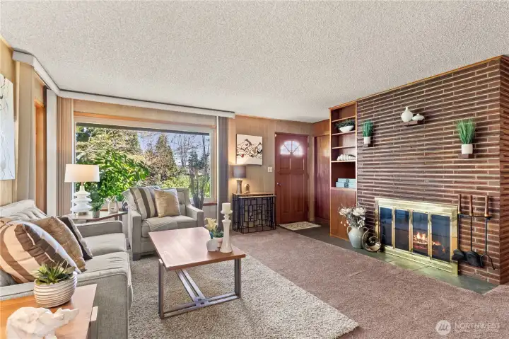 Living room features a wood burning fireplace and solid wood built-ins