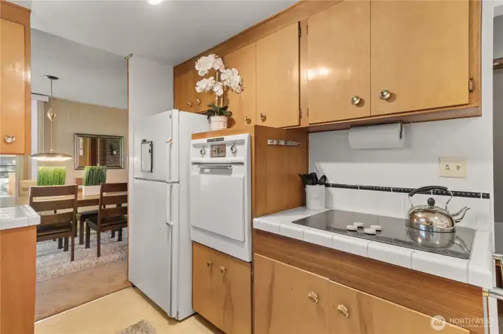 Kitchen appliances stay and the kitchen features the original oven that still works perfectly