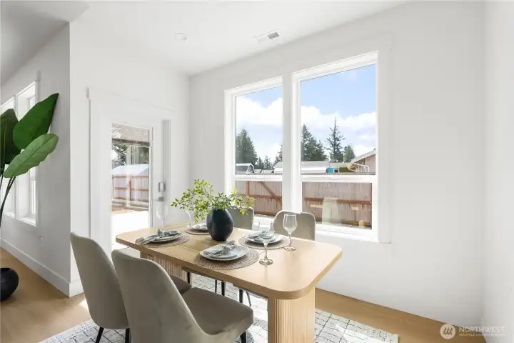 Dining area with outdoor patio access.