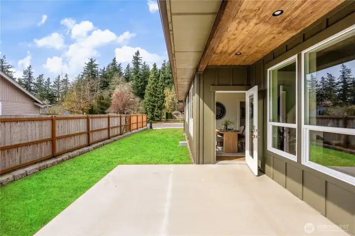 Covered backyard patio with electric and natural gas stub-outs for BBQ and outdoor living.