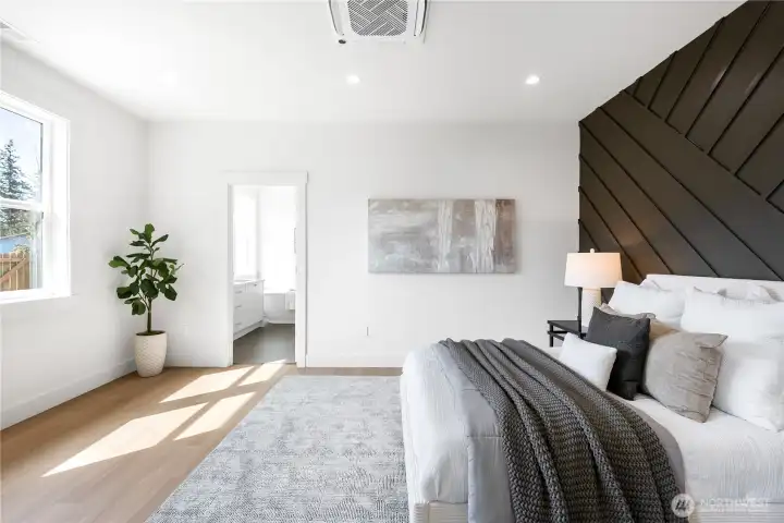 Large primary bedroom with an en suite bath and walk-in closet.