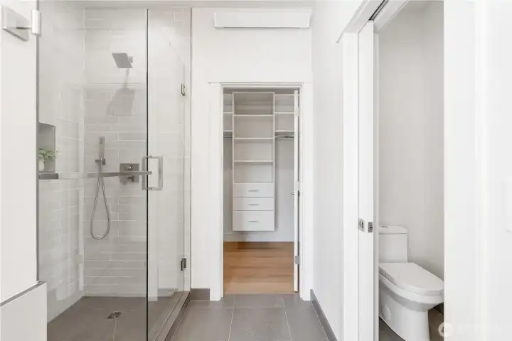 Custom tile baseboards. Full-Height tiled shower and shower pan, custom glass doors, recessed shower niche. Upgraded luxury 3-point shower system (rainfall, regular, and handheld). Separate toilet room with pocket door.