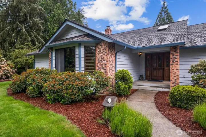 Come in the walkway to the home featuring a covered patio and newer roof - 50 year roof installed in 2021 - Warranty is transferrable! Come in the walkway to the home featuring a covered patio and newer roof - 50 year roof installed in 2021 - Warranty is transferrable!