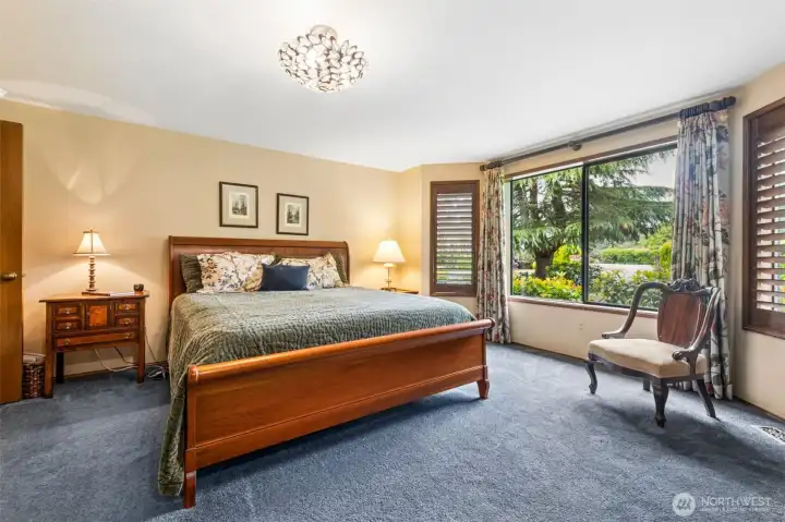Spacious Primary Suite with newer light fixtures and carpet and double-door entry. Spacious Primary Suite with newer light fixtures and carpet and double-door entry.
