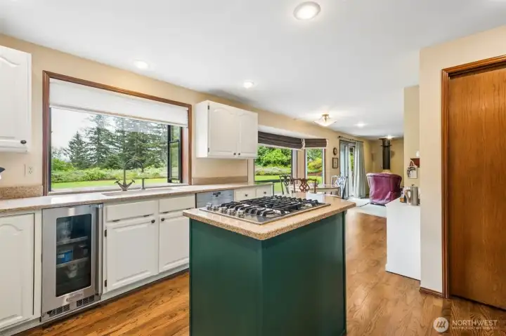 Here's the other side of the island. From here you can see the Wine/Beverage Fridge - plus the door to the right here takes you into a walk-in-pantry. Here's the other side of the island. From here you can see the Wine/Beverage Fridge - plus the door to the right here takes you into a walk-in-pantry.