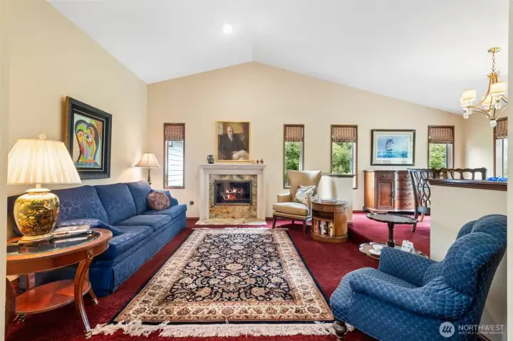 Impressive living room, with newer carpet and breathtaking remodeled fireplace with Onyx Stone Hearth and inner surround with Limestone mantle. Impressive living room, with newer carpet and breathtaking remodeled fireplace with Onyx Stone Hearth and inner surround with Limestone mantle.
