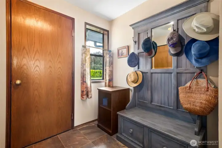 One half of the laundry room, with this door taking you to the roomy two car garage at 730 sq ft! Storage in the garage remains with the home. One half of the laundry room, with this door taking you to the roomy two car garage at 730 sq ft! Storage in the garage remains with the home.