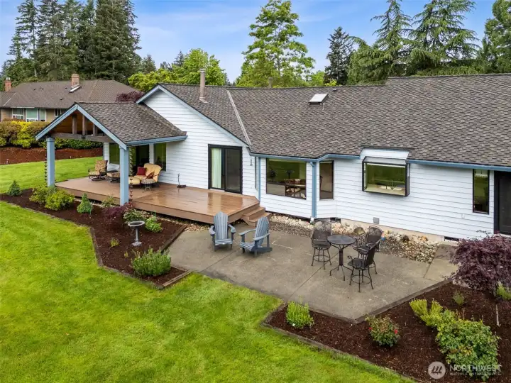 As we come in closer you can see the patio, and the newer trek deck and Timberline Patio Cover added in 2021 with a 50 year warranty and features the new roofing added in 2021. As we come in closer you can see the patio, and the newer trek deck and Timberline Patio Cover added in 2021 with a 50 year warranty and features the new roofing added in 2021.