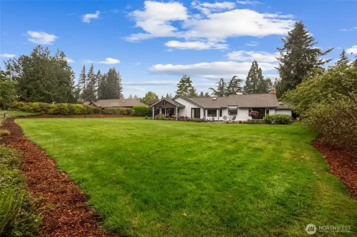 Here's a photo just showing the scope of the size of the yard. The septic is in the front yard, so you could put a sport court or something else fun back here! Here's a photo just showing the scope of the size of the yard. The septic is in the front yard, so you could put a sport court or something else fun back here!