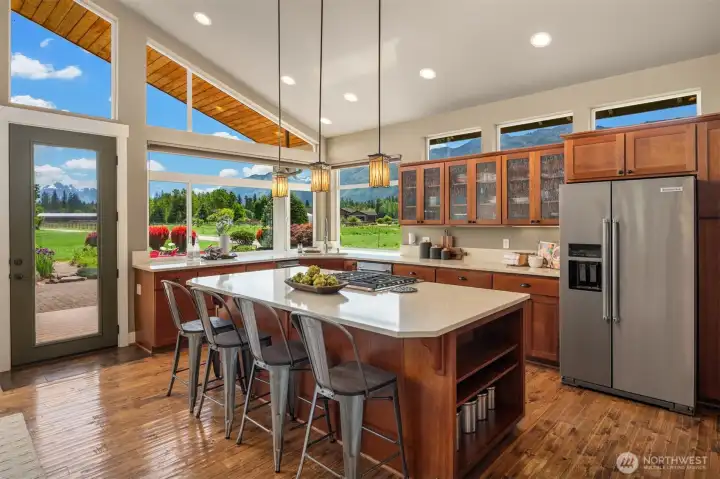 Kitchen features quartz countertops and striking views of the Cascades. What a peaceful place to enjoy a coffee in the morning!