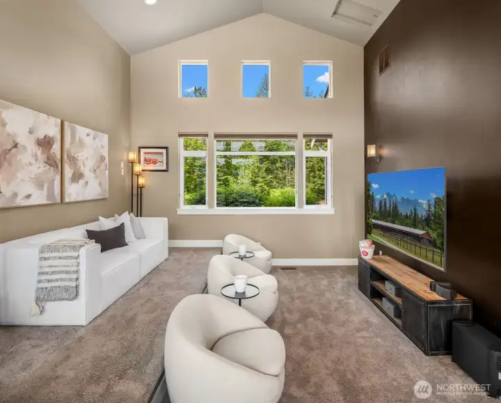 Take your movie nights to the next level in the movie theater space off Kitchen. Raised platform for seating gives the complete movie theater experience!