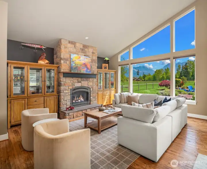 The rock propane fireplace dominates the living room space. Imagine curling up to the fire and watching snowflakes drift by in winter.