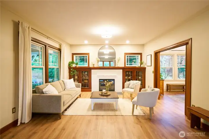 Formal living room South end with built ins and custom pocket doors to the library. Formal living room South end with built ins and custom pocket doors to the library.