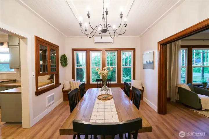 Formal dining room north end with original built in bench with storage underneath. Formal dining room north end with original built in bench with storage underneath.