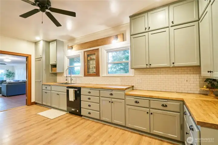 Other side of custom kitchen complete with baker's station (lower counter height on the right) Other side of custom kitchen complete with baker's station (lower counter height on the right)
