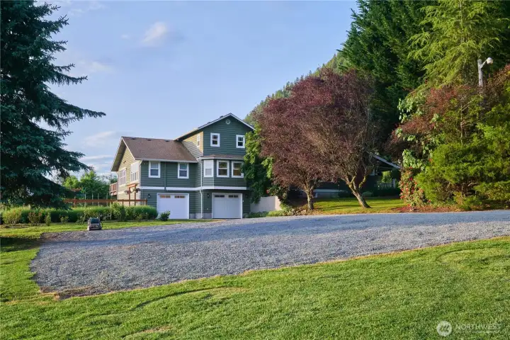 Lots of parking. You can drive down to the garage/daylight basement to enter the house, or use the font door on the main level. Lots of parking. You can drive down to the garage/daylight basement to enter the house, or use the font door on the main level.