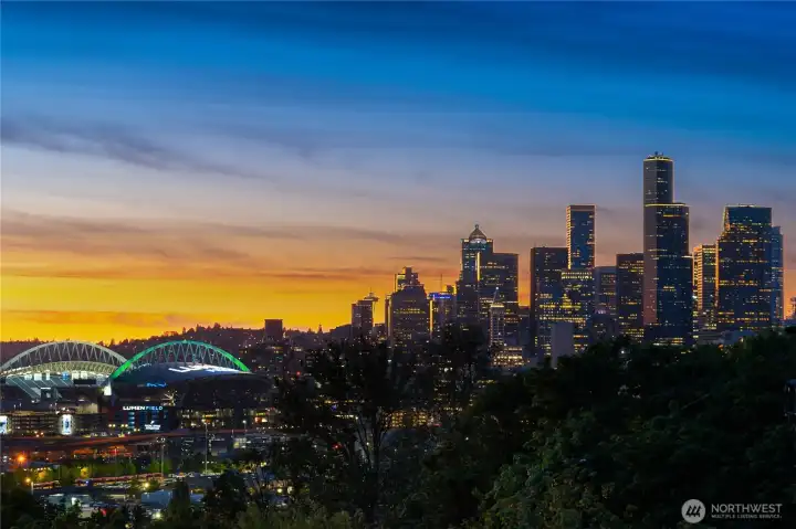 Lie in bed and gaze at the city skyline.