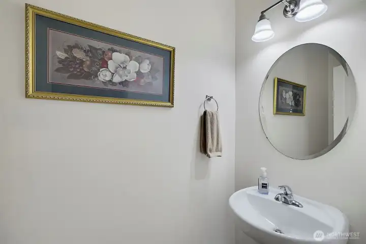 Convenient main-level powder room, thoughtfully located for guests and everyday use with clean finishes and easy accessibility.