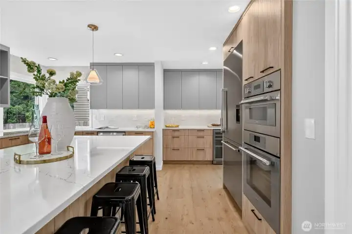 Oversized island with slab counter tops. Oversized island with slab counter tops.