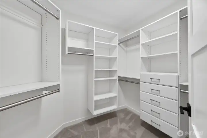 Primary closet with builtin closet system. Primary closet with builtin closet system.