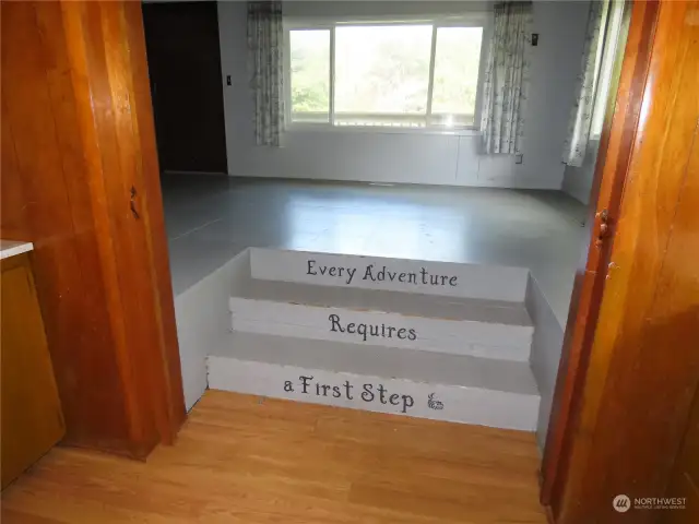 Steps from the kitchen to the living rom