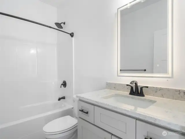 Main bathroom with granite countertops.