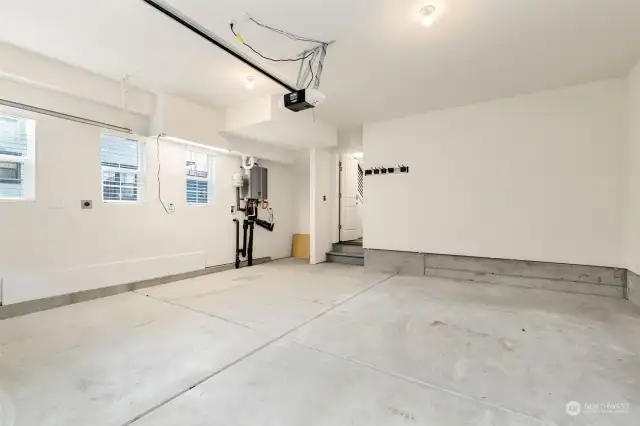 Two car garage with outlet for EV charging.