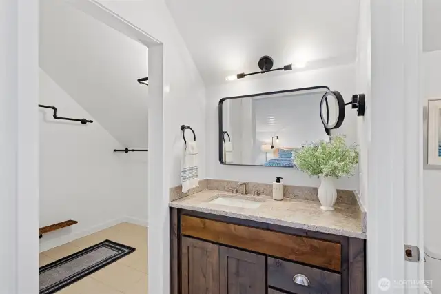Large walk in closet with good storage off of primary bedroom and bathroom