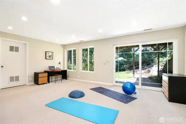Rec/flex room downstairs. Very spacious for many possibilities. The white door is a storage room and also houses the hot water heater tank and furnace.