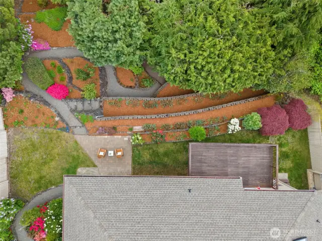 Terraced backyard is fully landscaped.