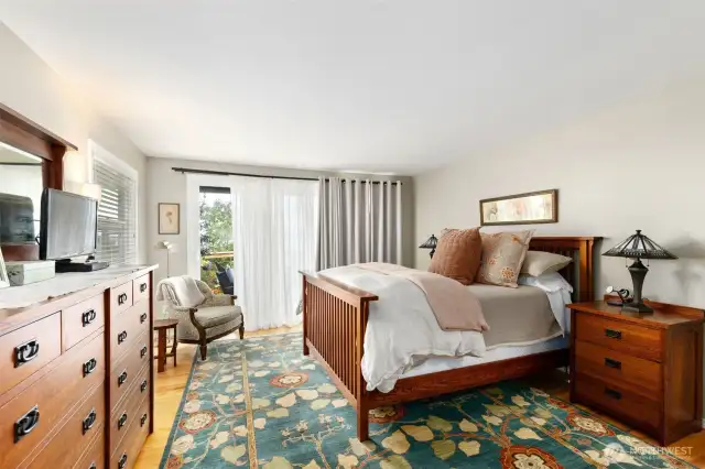 Primary Bedroom, with access to wrap-around deck & views.