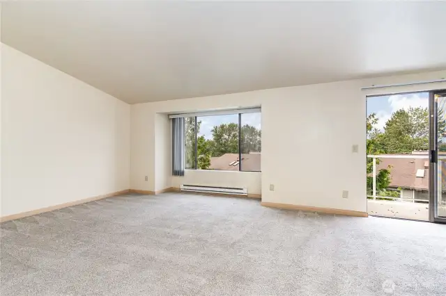 Condo opens to this spacious open living room.