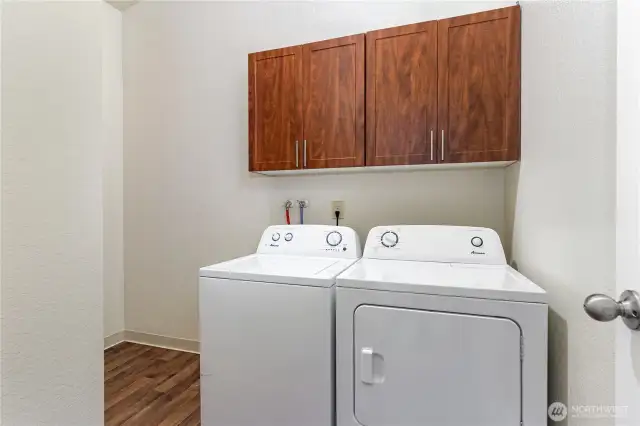 Laundry Room with plenty of space to add more shelving for storage!
