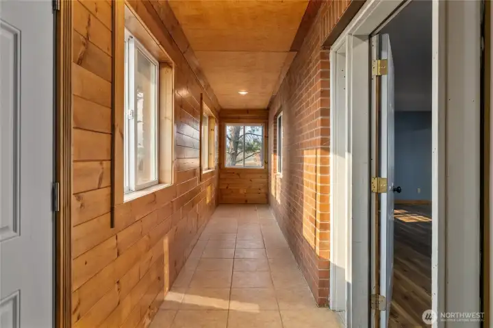 Entry with covered area.  Perfect spot for greenhouse or cozy coffee nook.