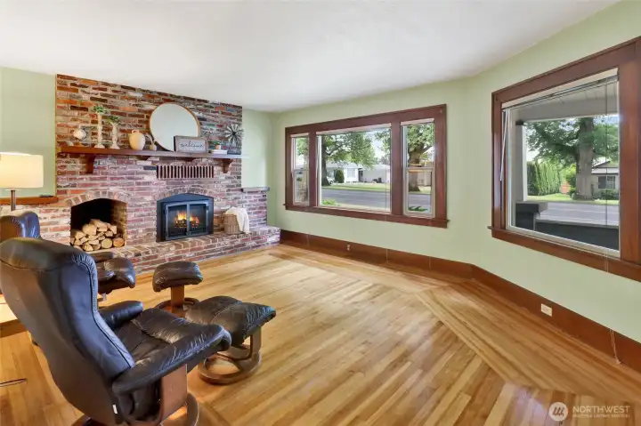 Every home deserves a parlor room, and this one shines with a beautiful brick-surround fireplace, rich hardwood floors, and wide trim throughout. Enjoy Front St views, then close it in with the vintage pocket door for extra coziness.