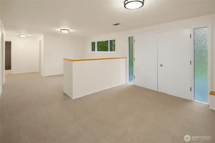 lower level rec room with doors to the yard